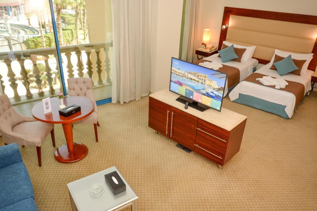 Helnan Dream Hotel And Conference Center 6th of October City Exterior photo A hotel room with a television